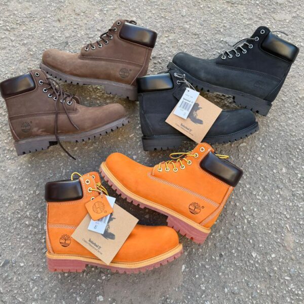Timberland Classic Waterproof Boots in brown, black, and orange, featuring rugged design and waterproof construction for outdoor enthusiasts.