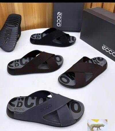 ECCO men's slide sandals in black and brown, displayed with boxes and packaging on a white table.
