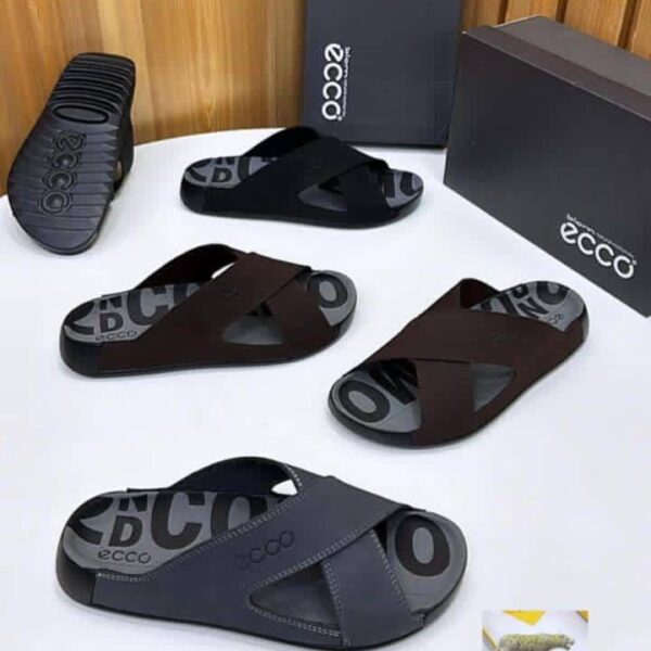 ECCO men's slide sandals in black and brown, displayed with boxes and packaging on a white table.