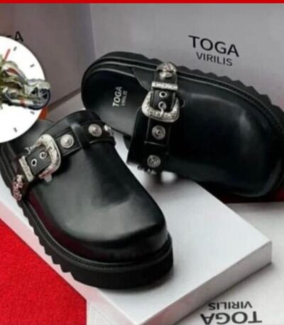 A pair of black leather clogs with silver buckles on a white box, showcasing the Toga Virilis logo, perfect for luxury footwear enthusiasts.