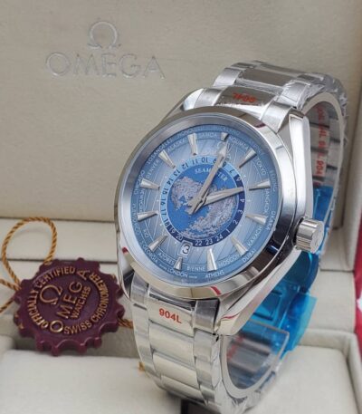 A luxurious Omega Seamaster World Time watch with a blue dial and stainless steel band, presented in its elegant box with a red tag.