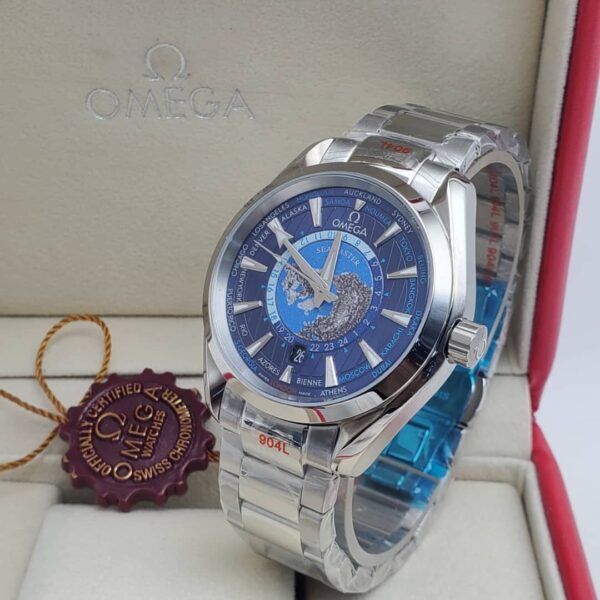 A luxurious Omega World Time watch with a blue dial and stainless steel band, presented in an elegant box with a red interior and a certificate of authenticity.