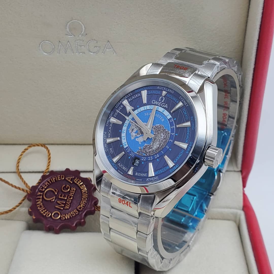 IMG-20260612-WA0011 A luxurious Omega World Time watch with a blue dial and stainless steel band, presented in an elegant box with a red interior and a certificate of authenticity.