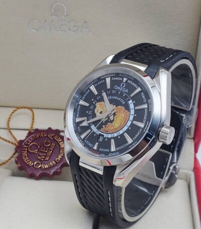 A luxurious Omega Seamaster World Time watch with a black dial and black leather strap, presented in an elegant box with a red seal.