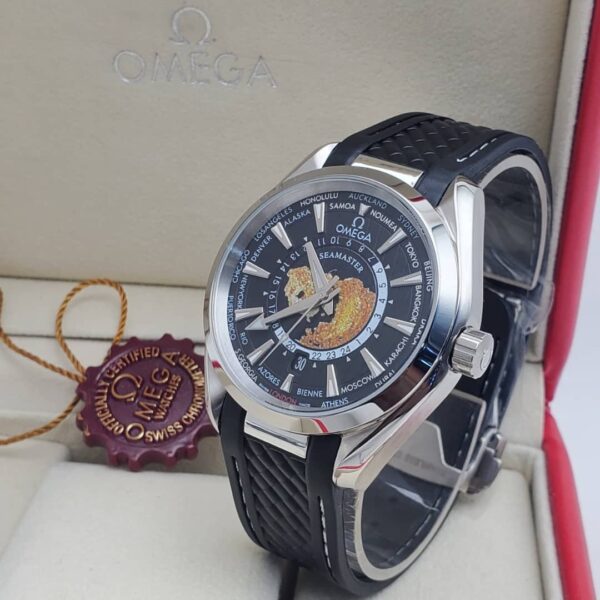 A luxurious Omega Seamaster World Time watch with a black dial and black leather strap, presented in an elegant box with a red seal.
