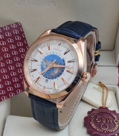 A luxurious Omega Worldtime watch with a rose gold case and blue leather strap, presented in an elegant box with a red and gold seal, perfect for those seeking a high-end accessory in Nigeria.