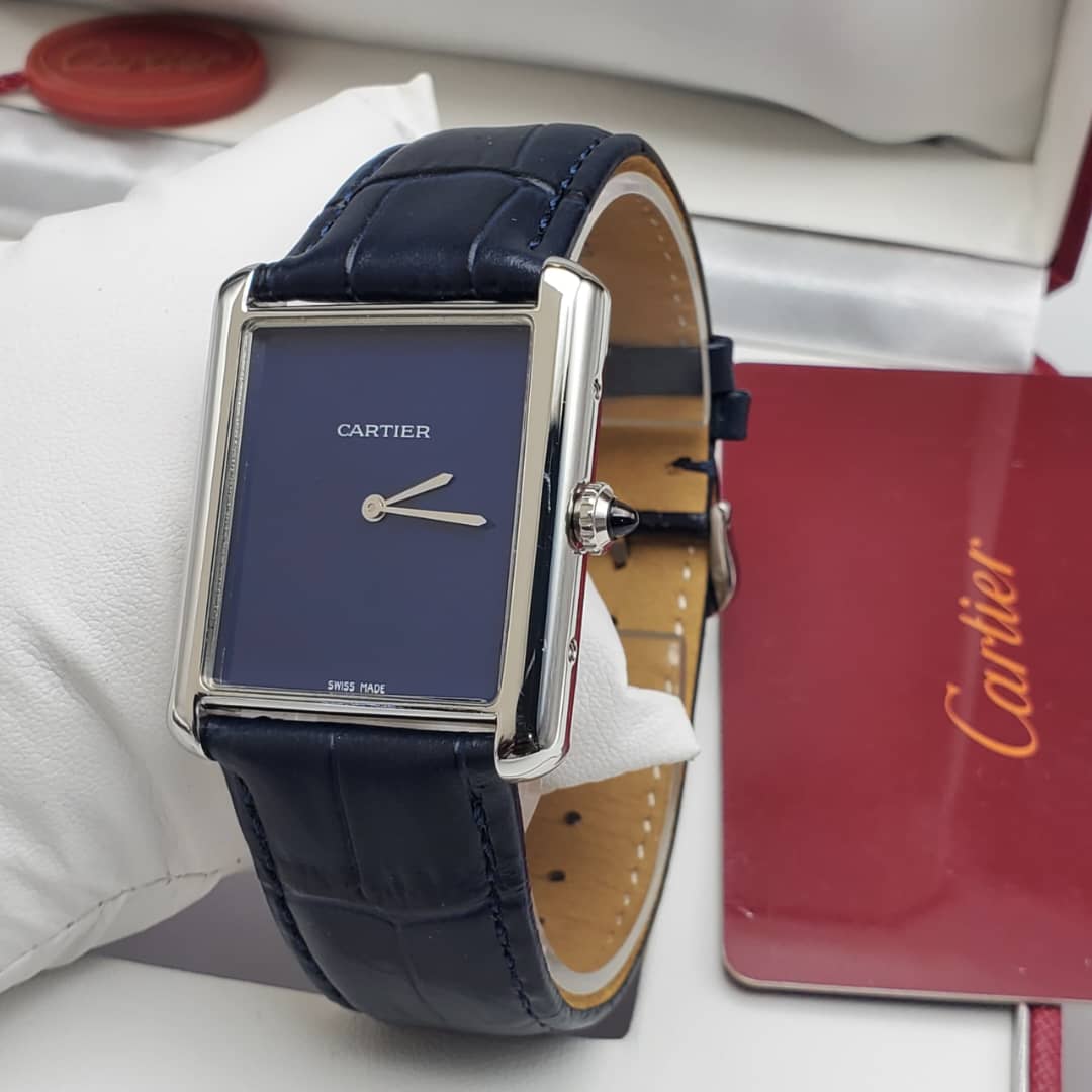 IMG-20260612-WA0018 A luxurious Cartier Tank Solo watch with a navy blue dial and leather strap, exuding sophistication and refinement.
