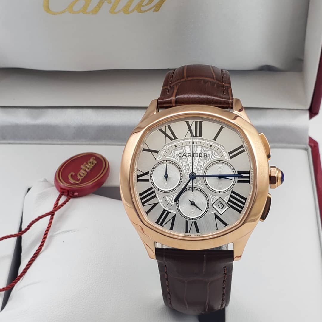 IMG-20260612-WA0025 A luxurious Cartier rose gold watch with brown leather strap, showcased in its elegant box with red tag.