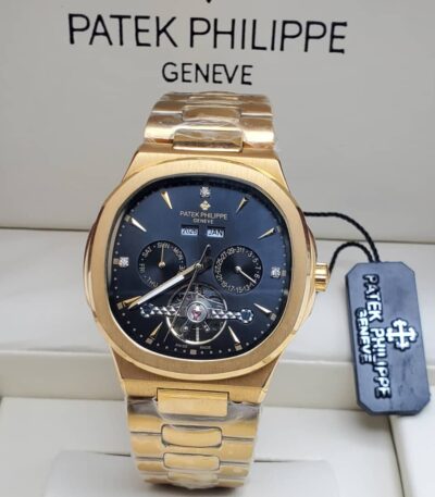 A gold Patek Philippe Geneve men's watch with a black dial and date display, presented in a luxurious setting.