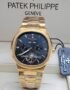 A gold Patek Philippe Geneve men's watch with a black dial and date display, presented in a luxurious setting.