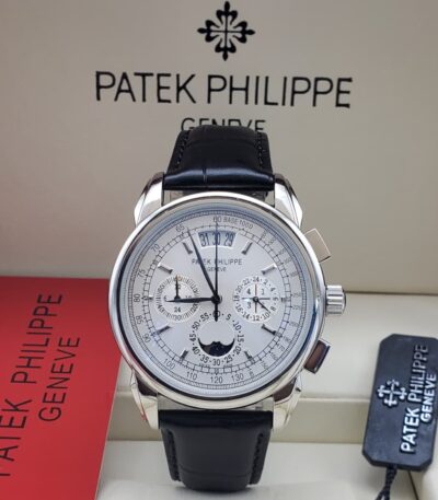 A luxurious Patek Philippe Geneve perpetual calendar watch with a black leather strap, showcased in its elegant packaging.