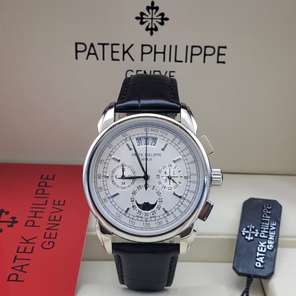 A luxurious Patek Philippe Geneve perpetual calendar watch with a black leather strap, showcased in its elegant packaging.