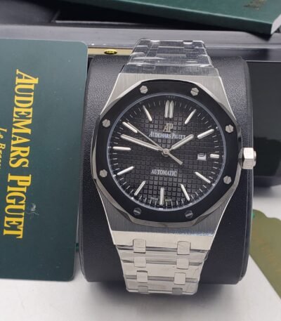 Audemars Piguet luxury watch with black dial and stainless steel band, presented in its original box and packaging.