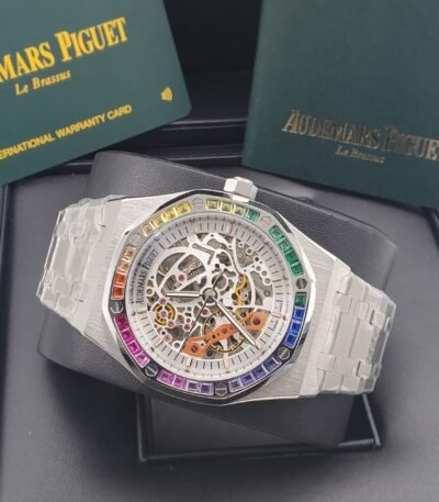 Audemars Piguet luxury watch with a rainbow bezel and transparent case, showcasing its intricate mechanical movement.